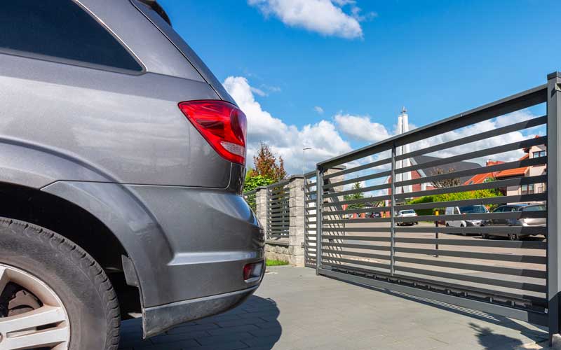 SUV with Gate Closed Behind It