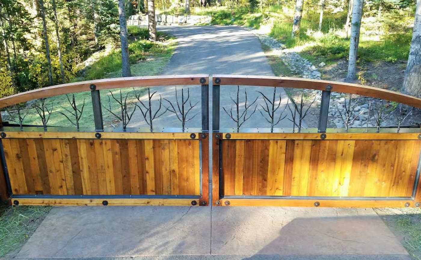 Wooden double swing gate powered by the Patriot gate opener